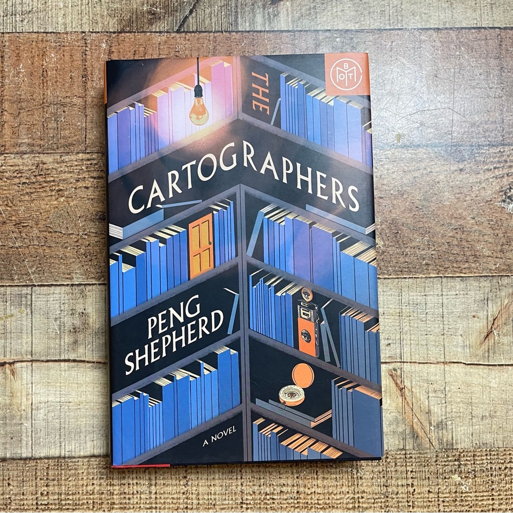 The Cartographers by Peng Shepherd - Blue and Orange Book